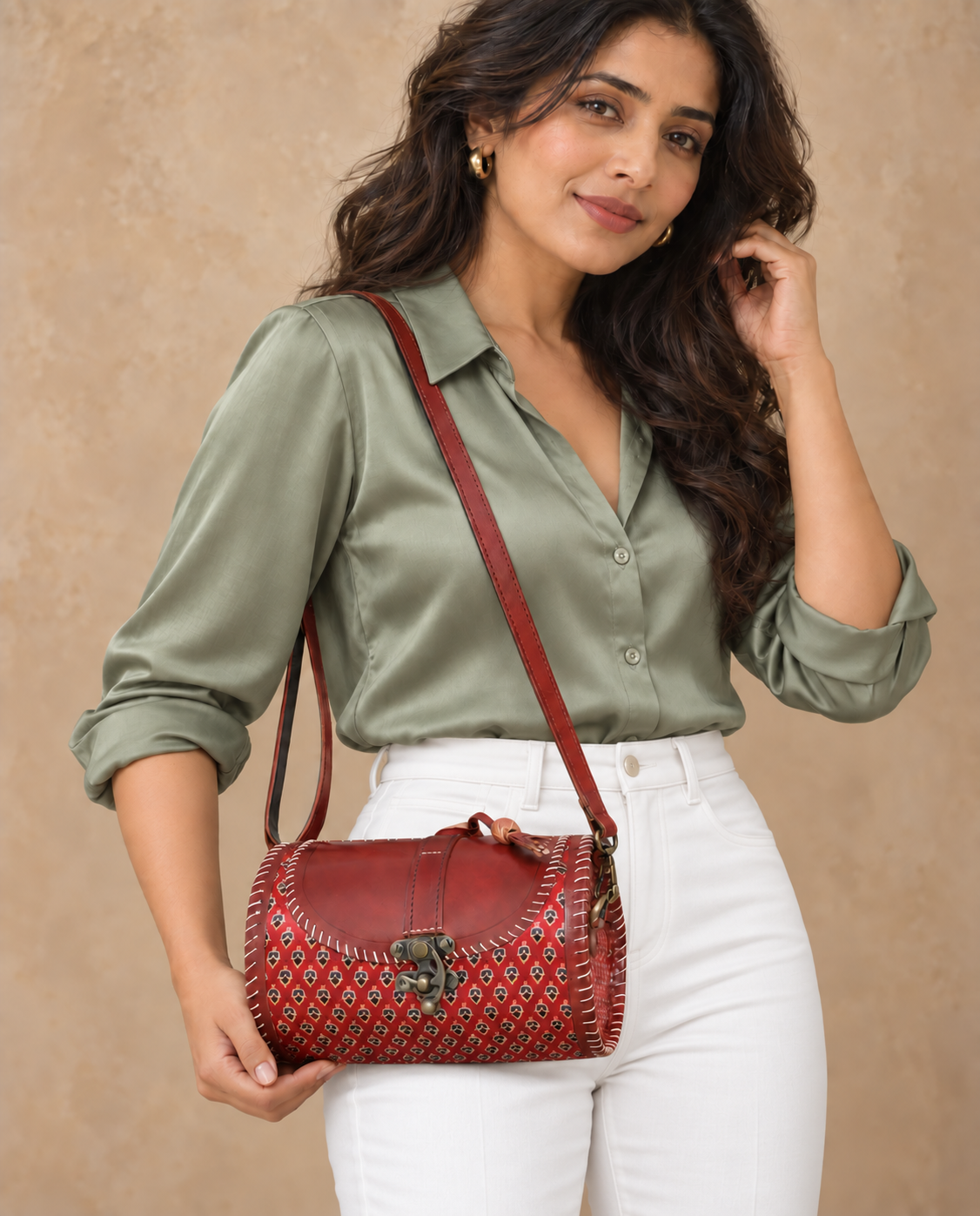 Traditional Dholak Handbag – Rust Red styled with a sage blouse and white pants