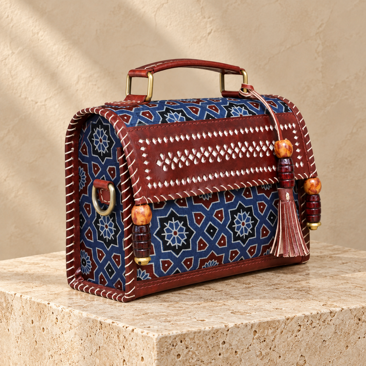 Side angle of Brown & Indigo Hut Handbag showing patterned side and sling attachment