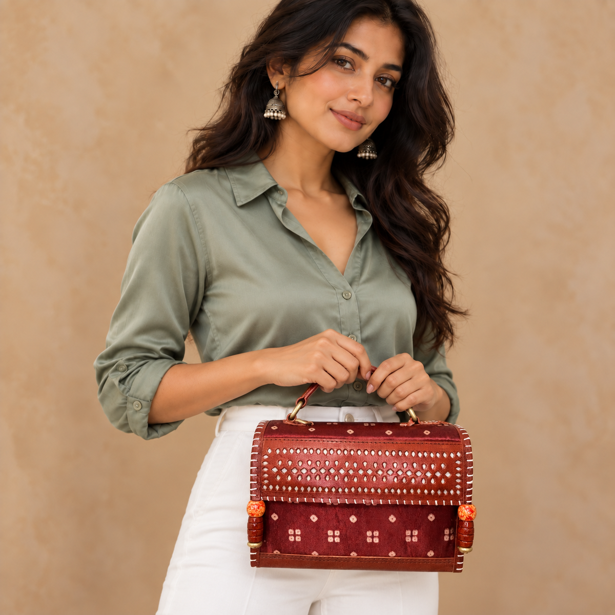 Hut Handbag – maroon bandhej – model wearing sage blouse and white pants
