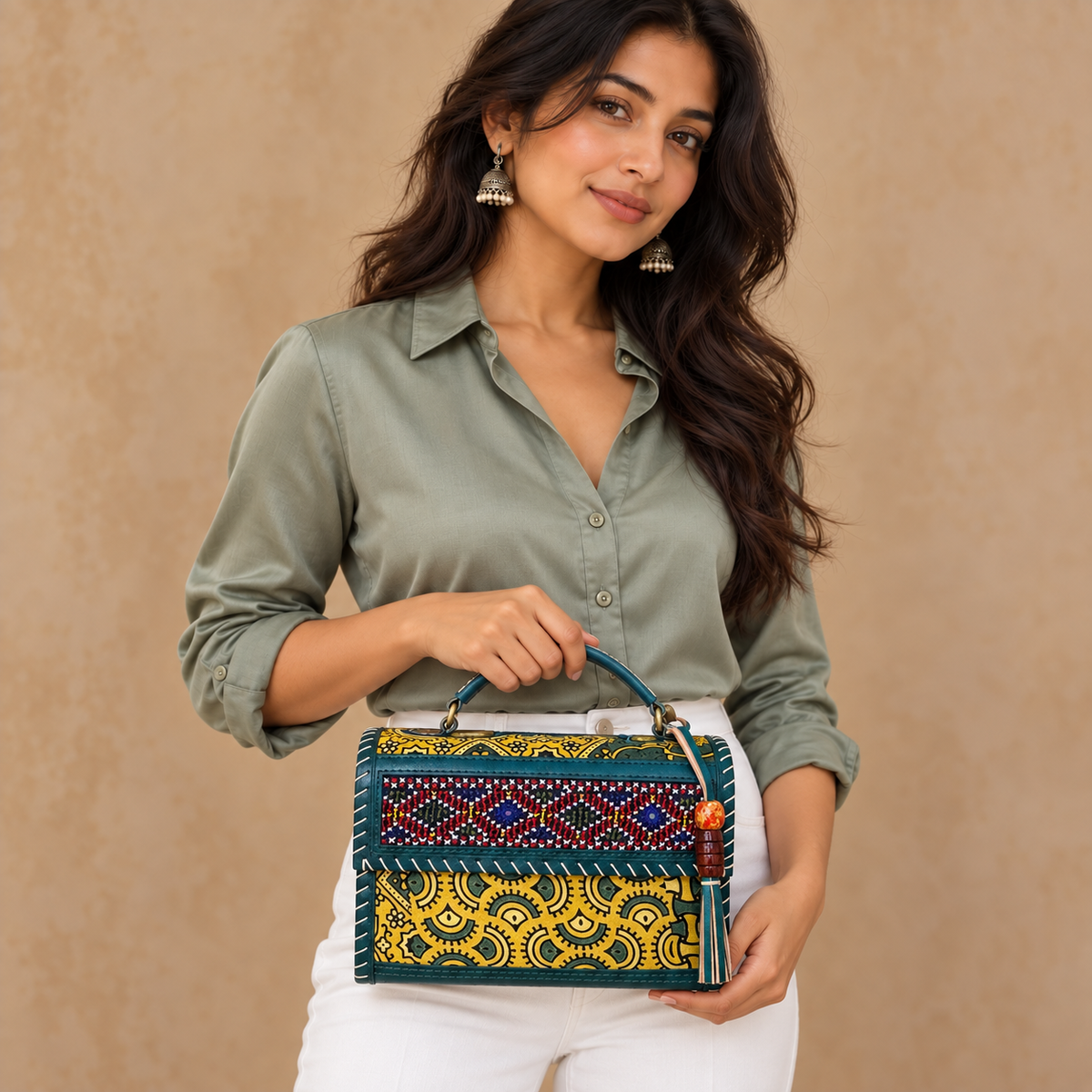 Hut Handbag in mustard teal – model wearing sage blouse and white pants